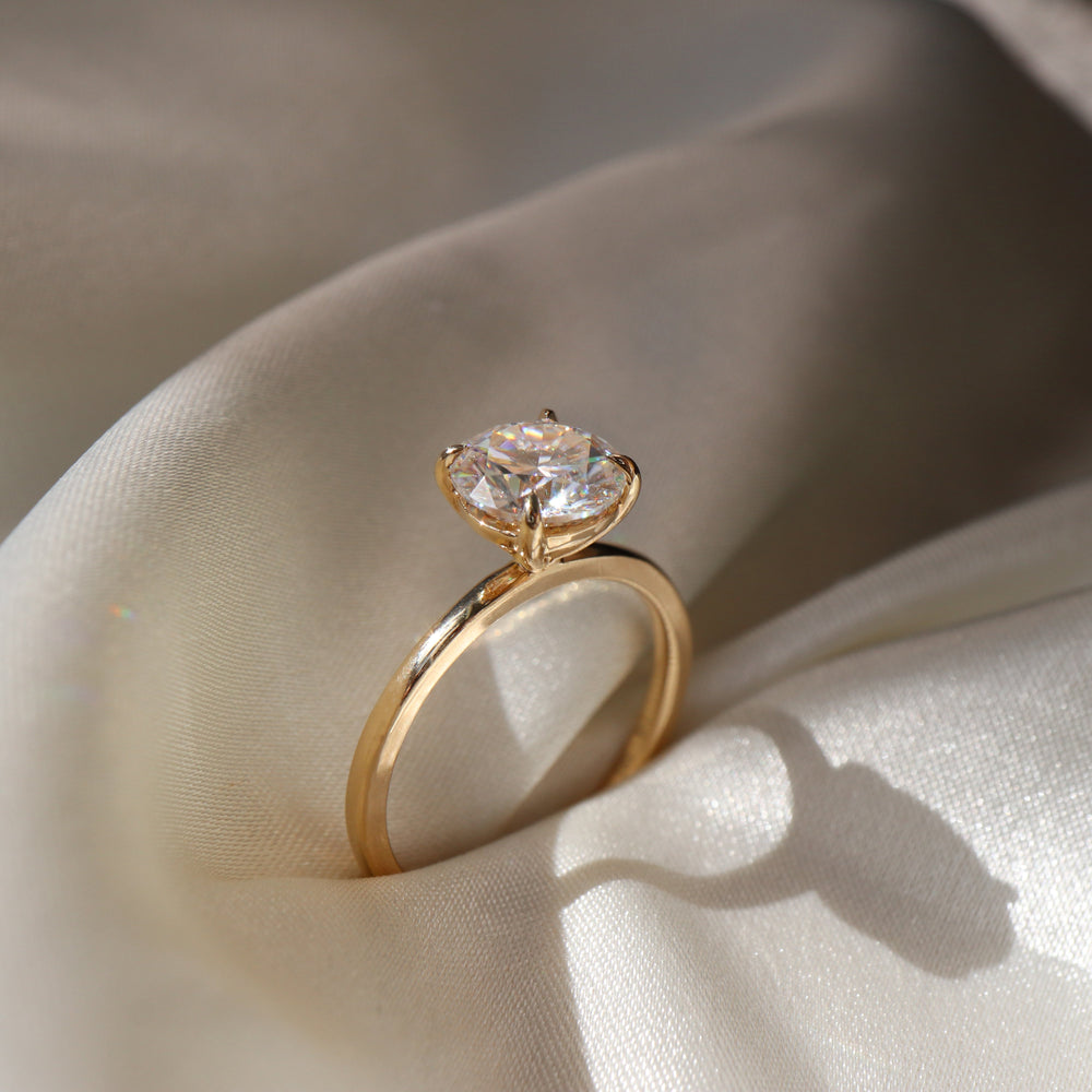 Classic solitaire ring with round moissanite center stone
