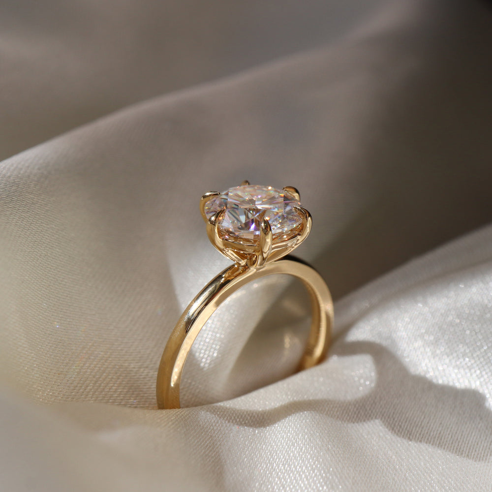Classic solitaire ring with round moissanite center stone