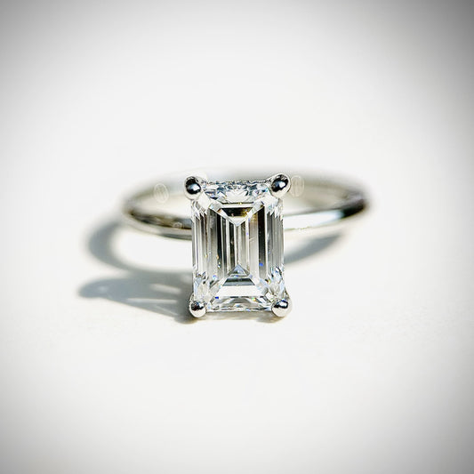 Emerald cut CVD lab grown diamond engagement ring featuring a hidden halo for added sparkle and refined elegance