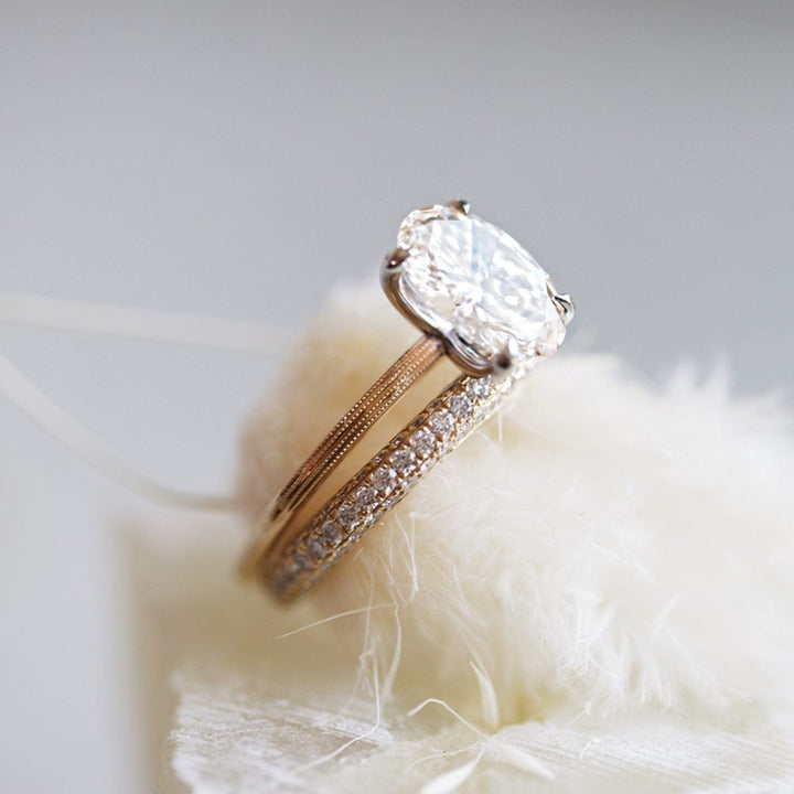 Round moissanite solitaire engagement ring with elegant band