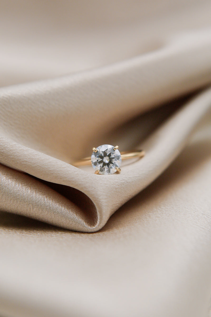 Round cut moissanite solitaire engagement ring
