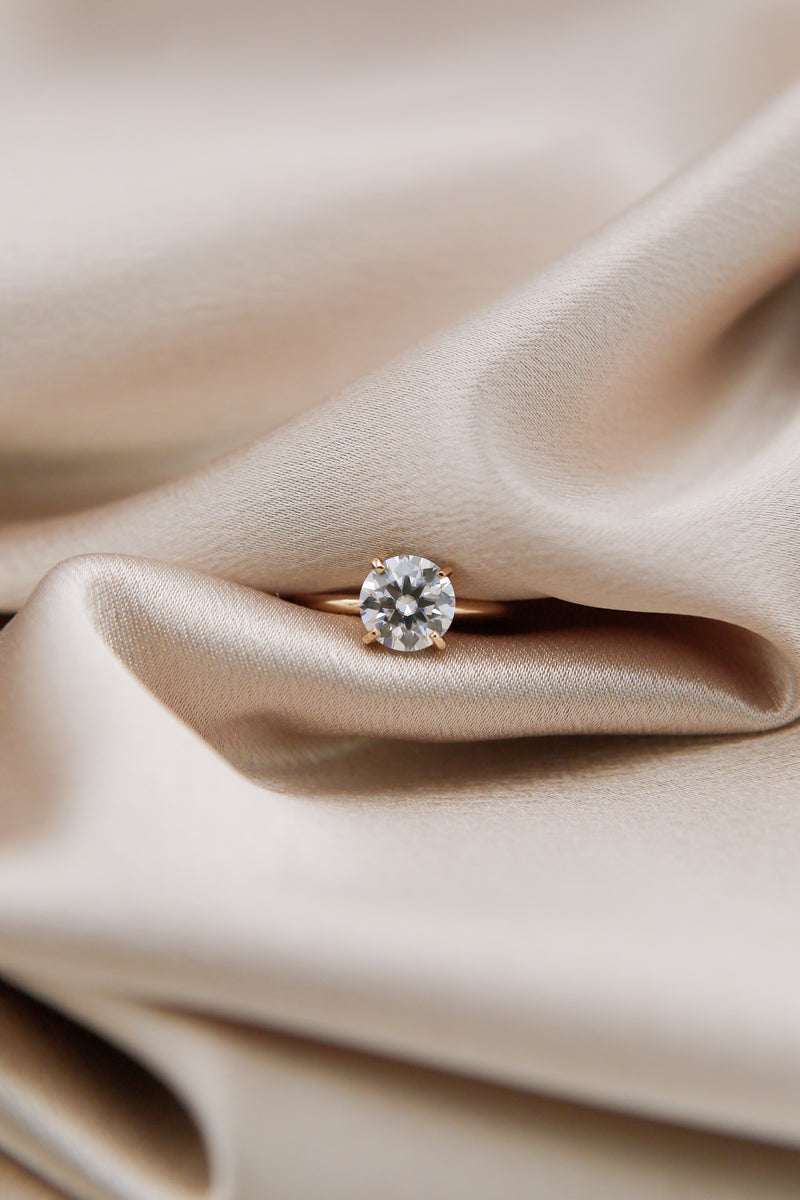 Round cut moissanite solitaire engagement ring
