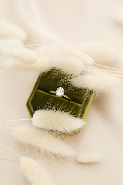 Elegant solitaire engagement ring with oval cut moissanite