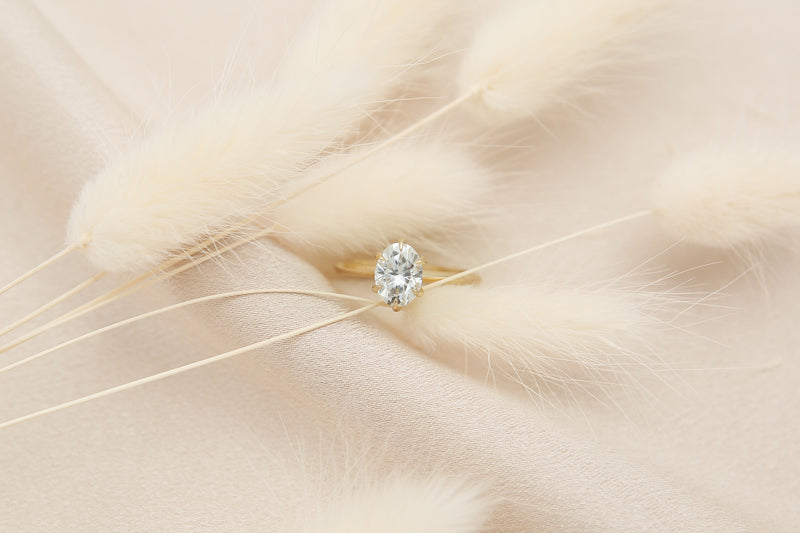Elegant solitaire engagement ring with oval cut moissanite