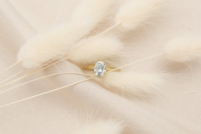 Elegant solitaire engagement ring with oval cut moissanite