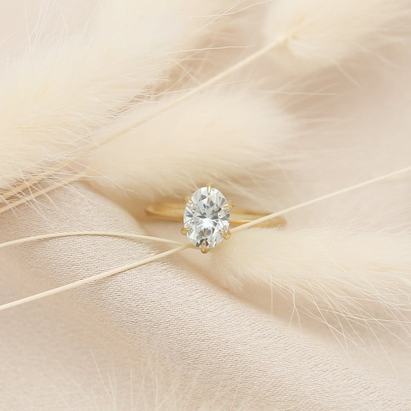 Elegant solitaire engagement ring with oval cut moissanite