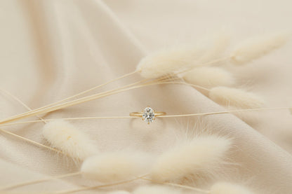 Elegant solitaire engagement ring with oval cut moissanite