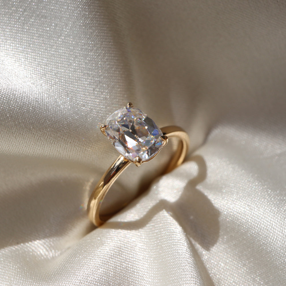 Solitaire engagement ring with cushion-cut moissanite center stone
