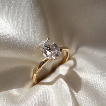 Solitaire engagement ring with cushion-cut moissanite center stone