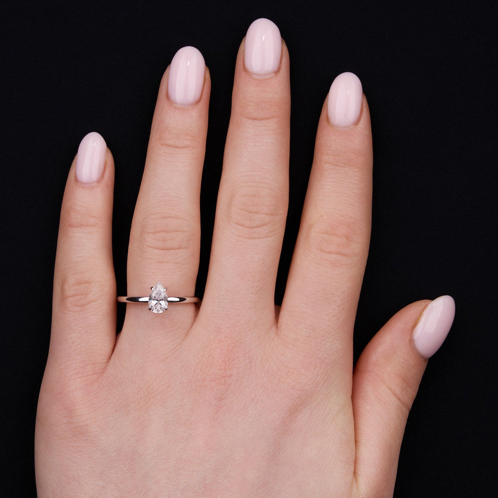 Elegant solitaire ring with pear-shaped moissanite center stone
