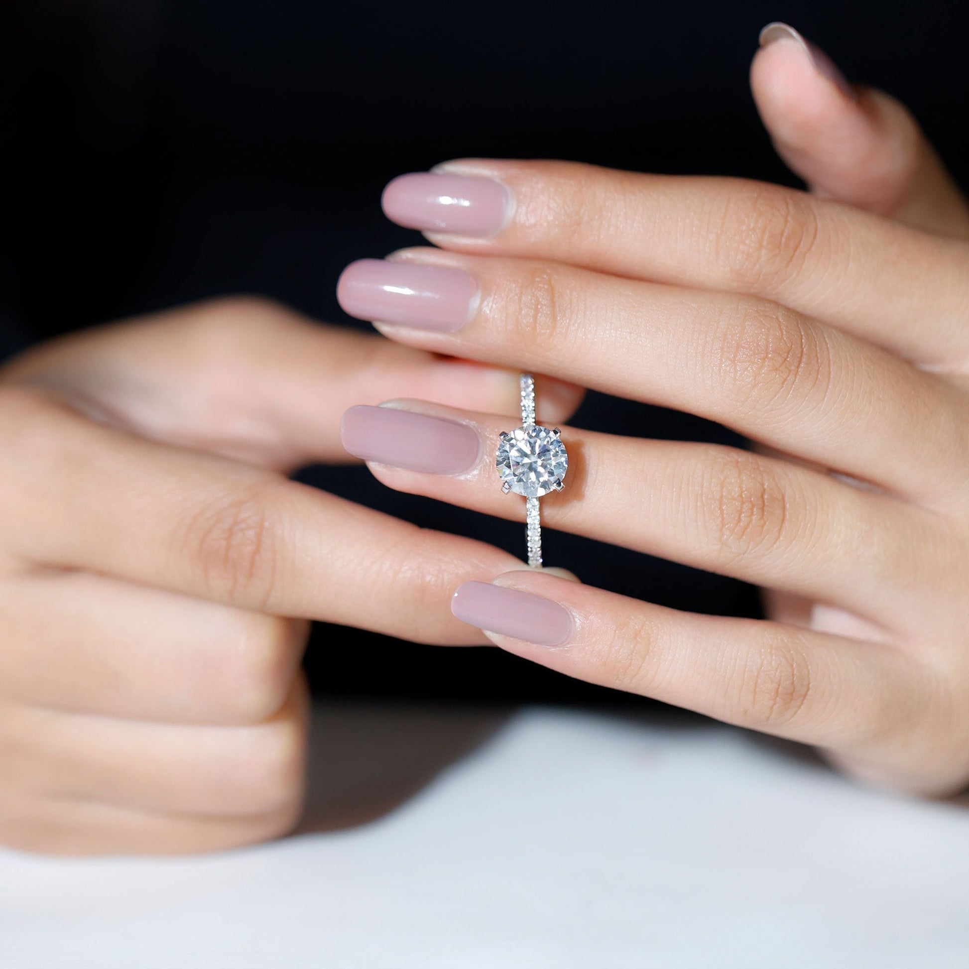 Round cut moissanite pave engagement ring with sparkling band