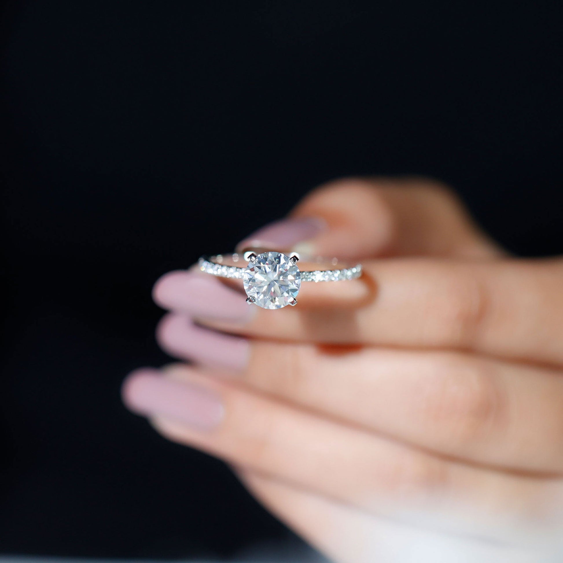 Round cut moissanite pave engagement ring with sparkling band