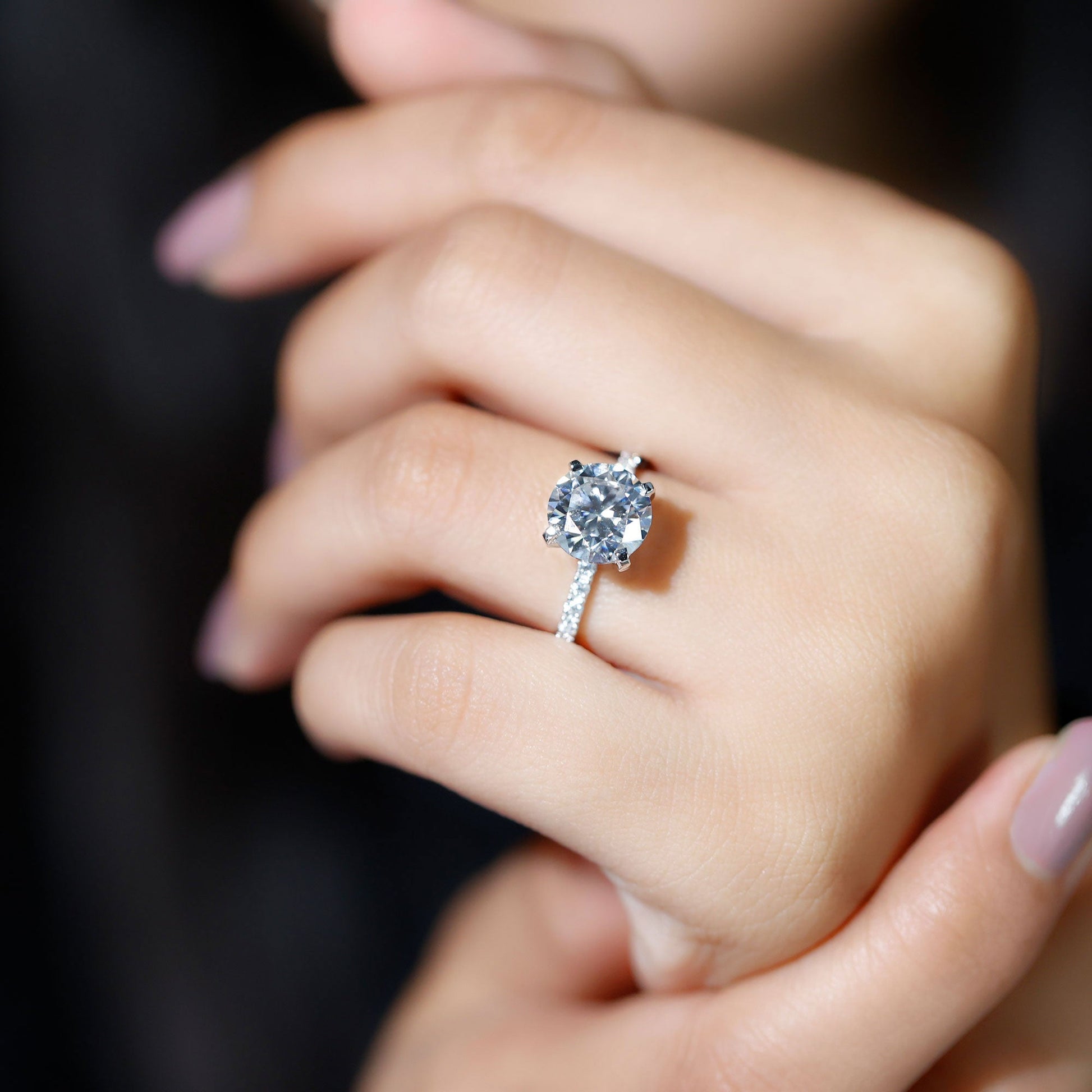 Round cut moissanite pave engagement ring with sparkling band