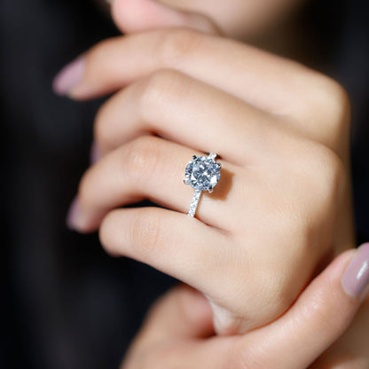 Round cut moissanite pave engagement ring with sparkling band
