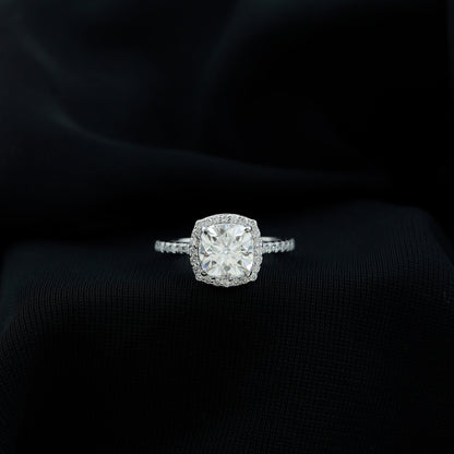 Cushion cut moissanite engagement ring with halo setting