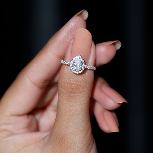 Halo & Pave Ring with 1.25 CT Pear Cut Moissanite