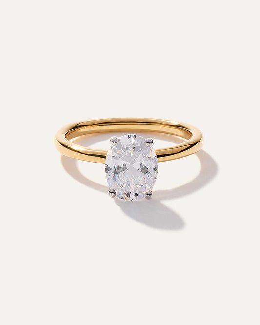 Oval cut CVD lab grown diamond solitaire engagement ring with sleek prong setting and smooth polished band for lasting beauty