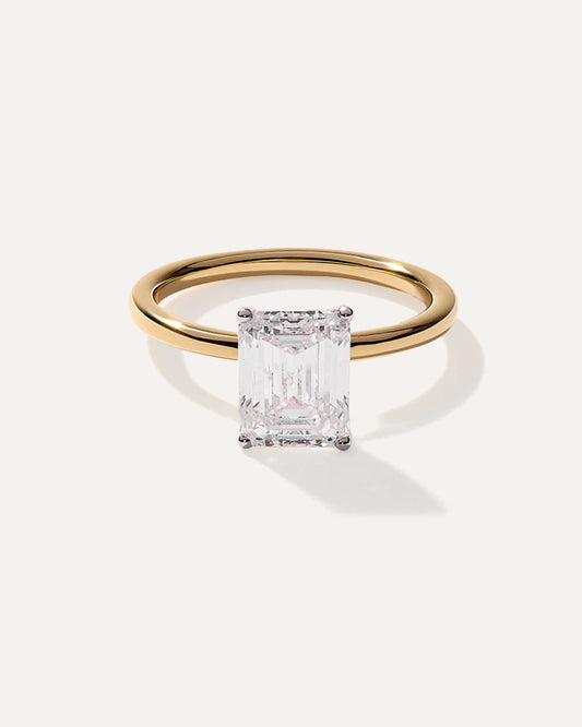 Emerald cut CVD lab grown diamond solitaire engagement ring with sleek prong setting and polished band for a refined classic look