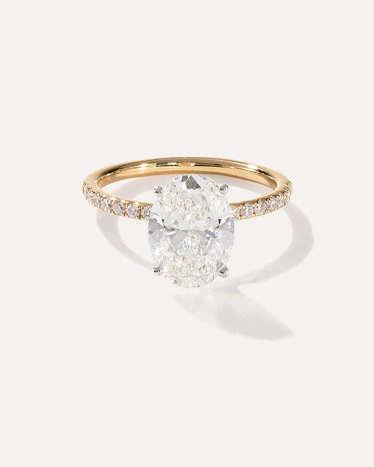 Oval cut CVD lab grown diamond engagement ring with pave-set band and classic prong setting for maximum brilliance