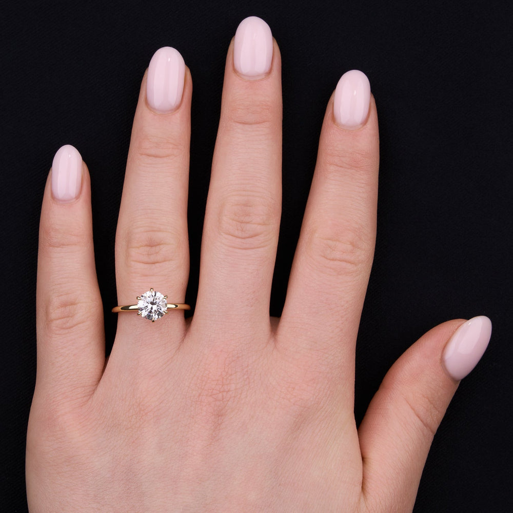 Classic solitaire ring with round moissanite center stone
