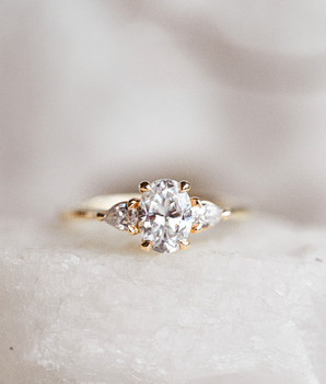 Three Stone Ring with 1.50 Ct Oval Moissanite