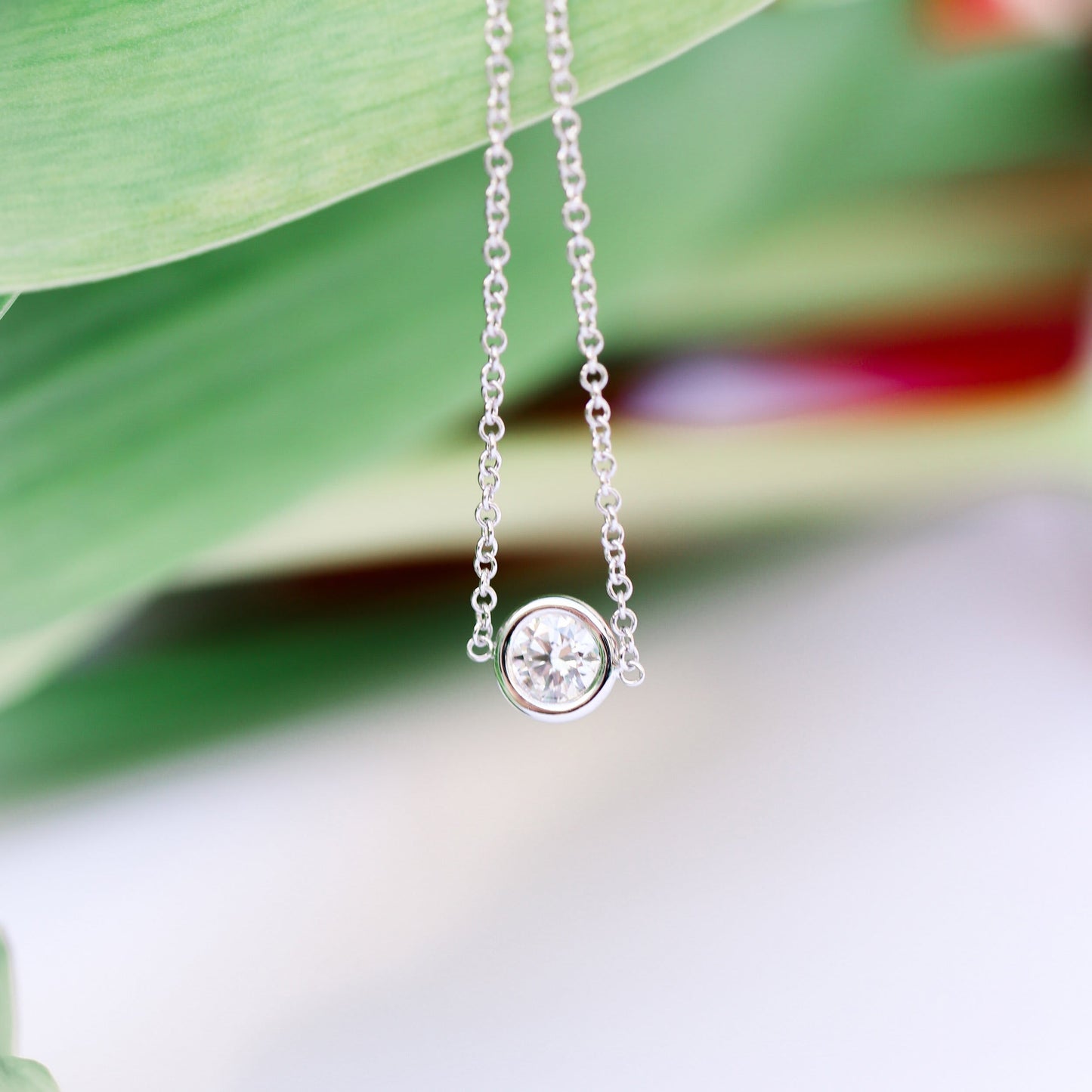 Single Bezel Necklace with 0.10 TCW Floating Cosmopolitan Round Cut Moissanite