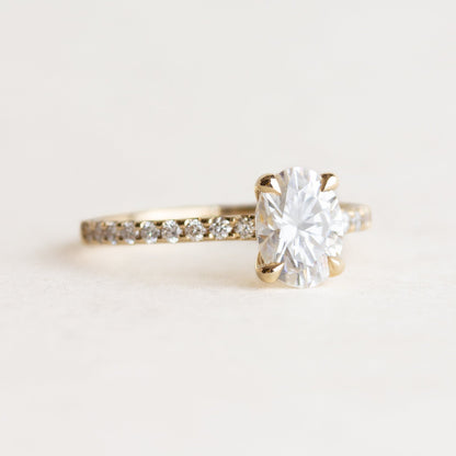 Oval cut CVD lab grown diamond pave engagement ring with slim band adorned with small round diamonds