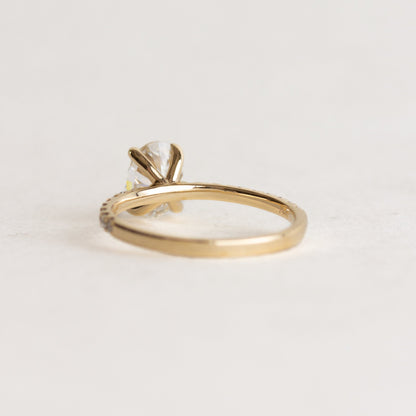 Oval cut CVD lab grown diamond pave engagement ring with slim band adorned with small round diamonds