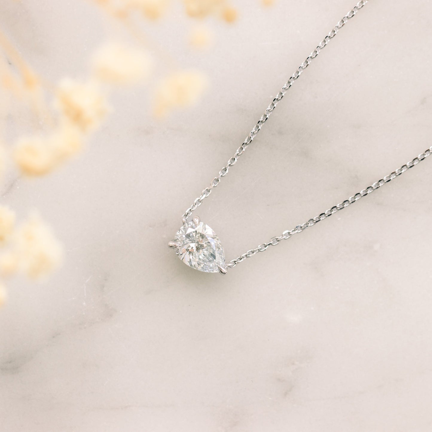 Solitaire Necklace with 0.40 CT Floating Pear Cut Moissanite