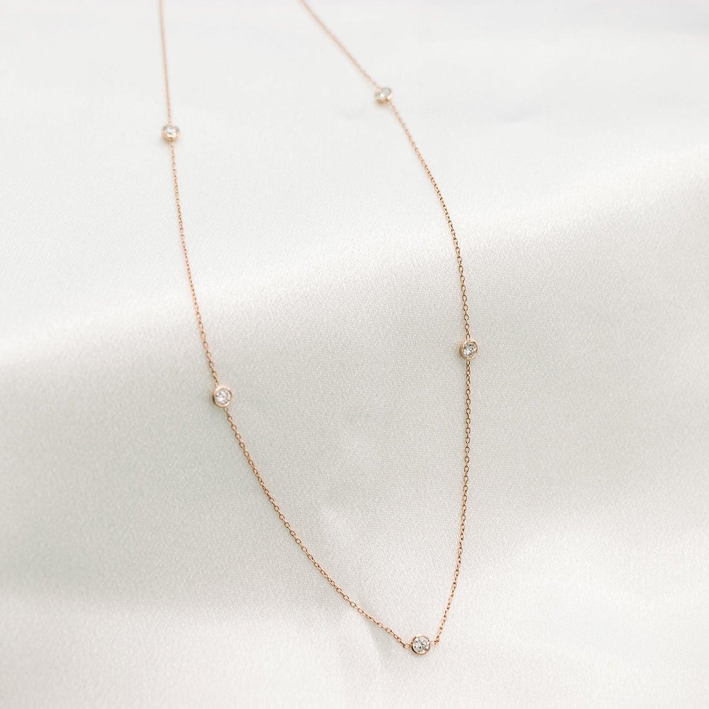 Five Bezel Necklace with 0.25 TCW Floating Cosmopolitan Round Cut Moissanite