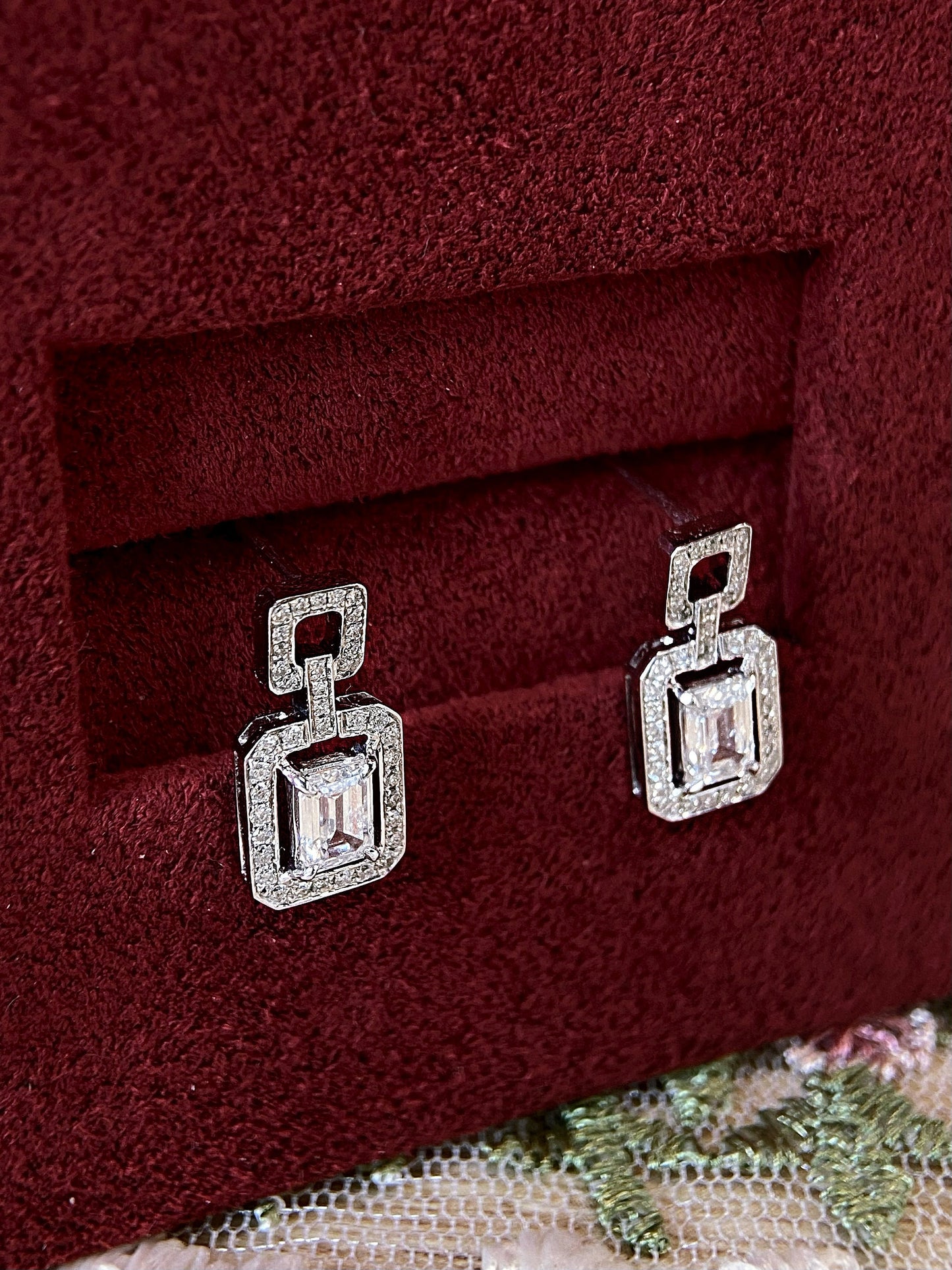 Halo Stud Earrings with 0.60 TCW Emerald Cut Moissanite