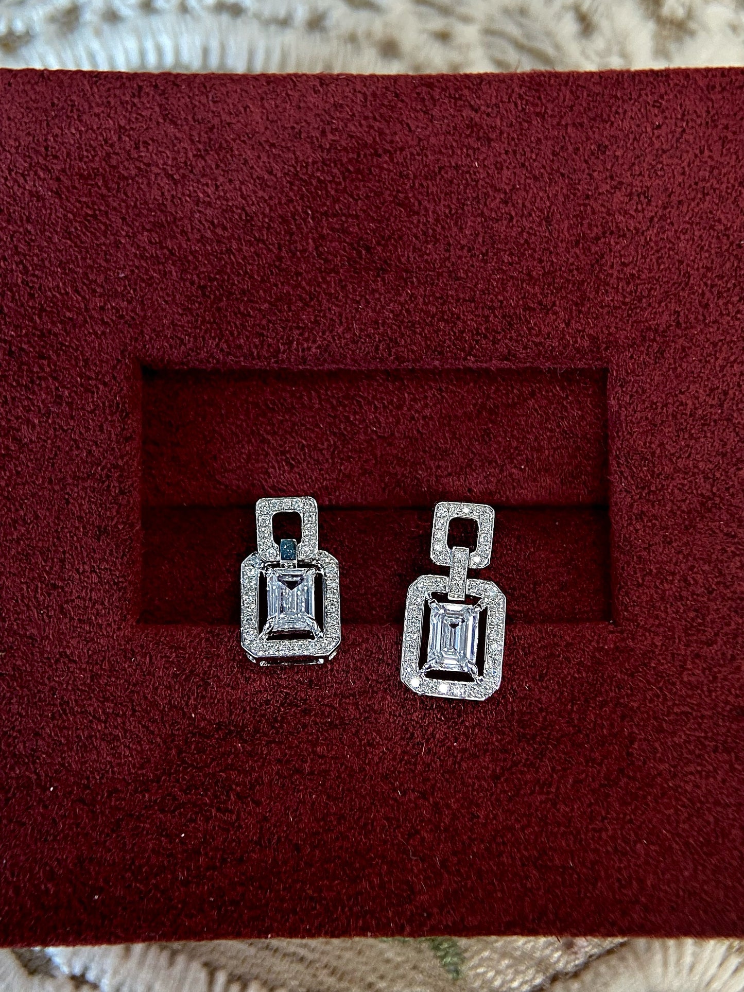 Halo Stud Earrings with 0.60 TCW Emerald Cut Moissanite