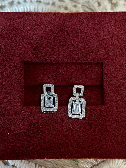 Halo Stud Earrings with 0.60 TCW Emerald Cut Moissanite
