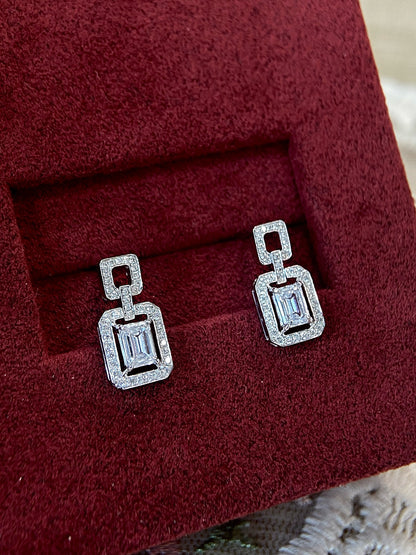 Halo Stud Earrings with 0.60 TCW Emerald Cut Moissanite