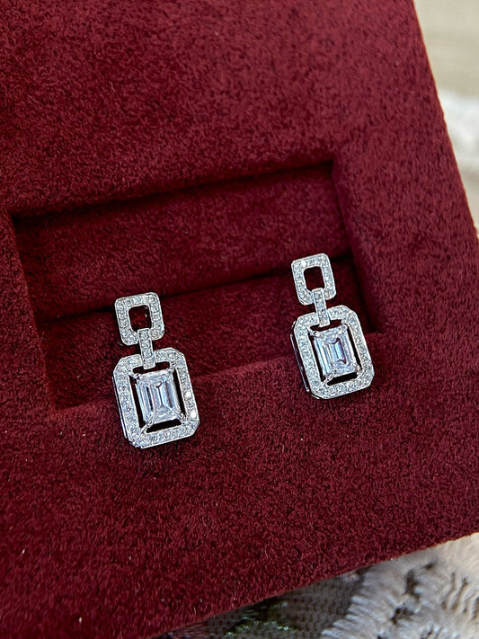Halo Stud Earrings with 0.60 TCW Emerald Cut Moissanite