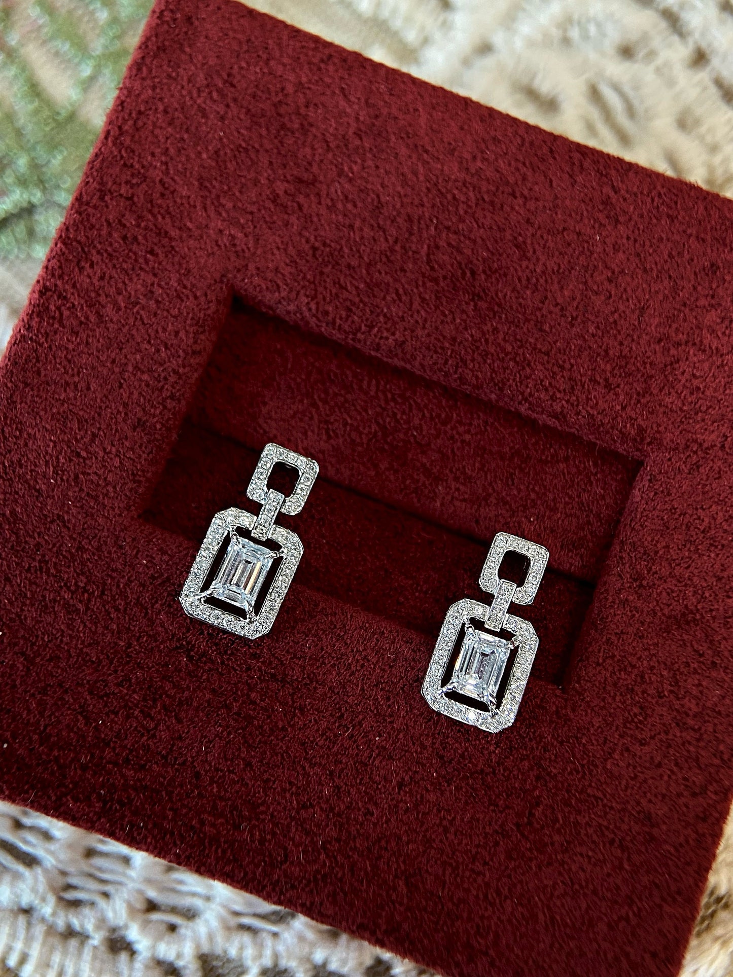Halo Stud Earrings with 0.60 TCW Emerald Cut Moissanite