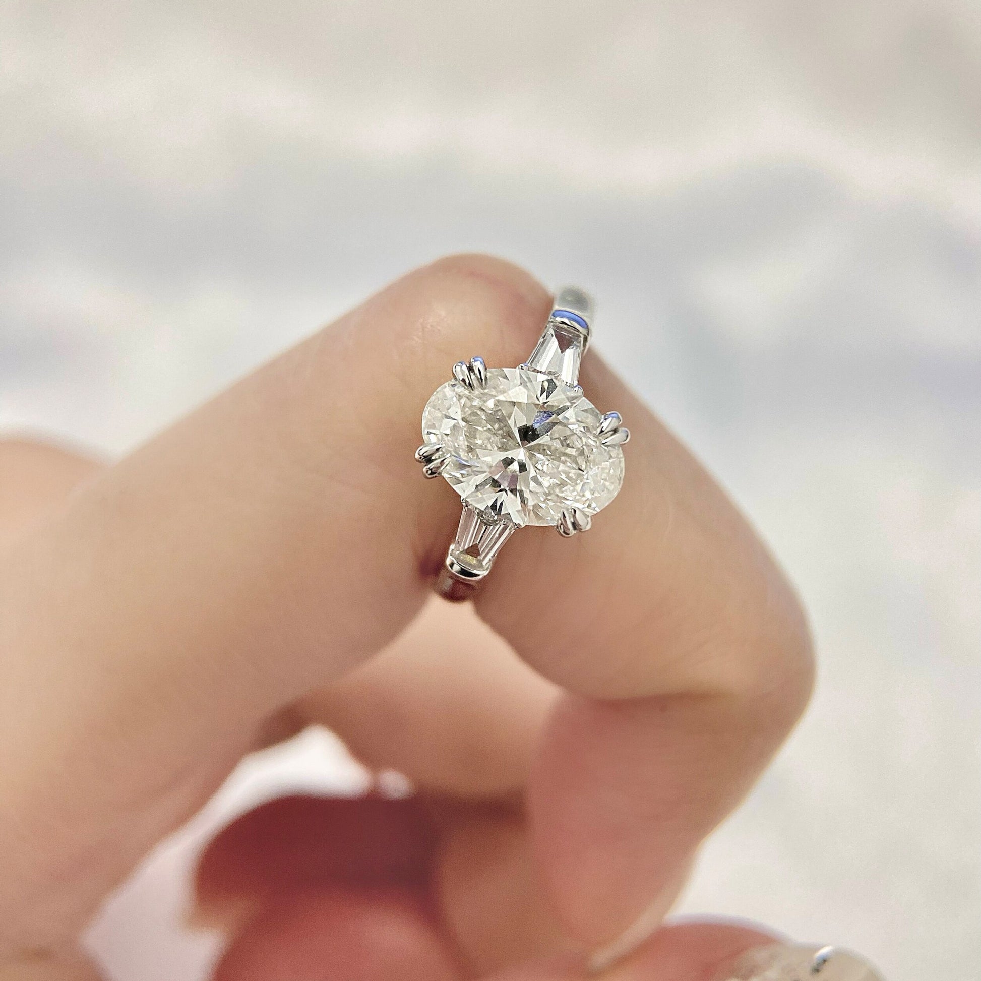 Oval cut CVD diamond three stone style engagement ring
