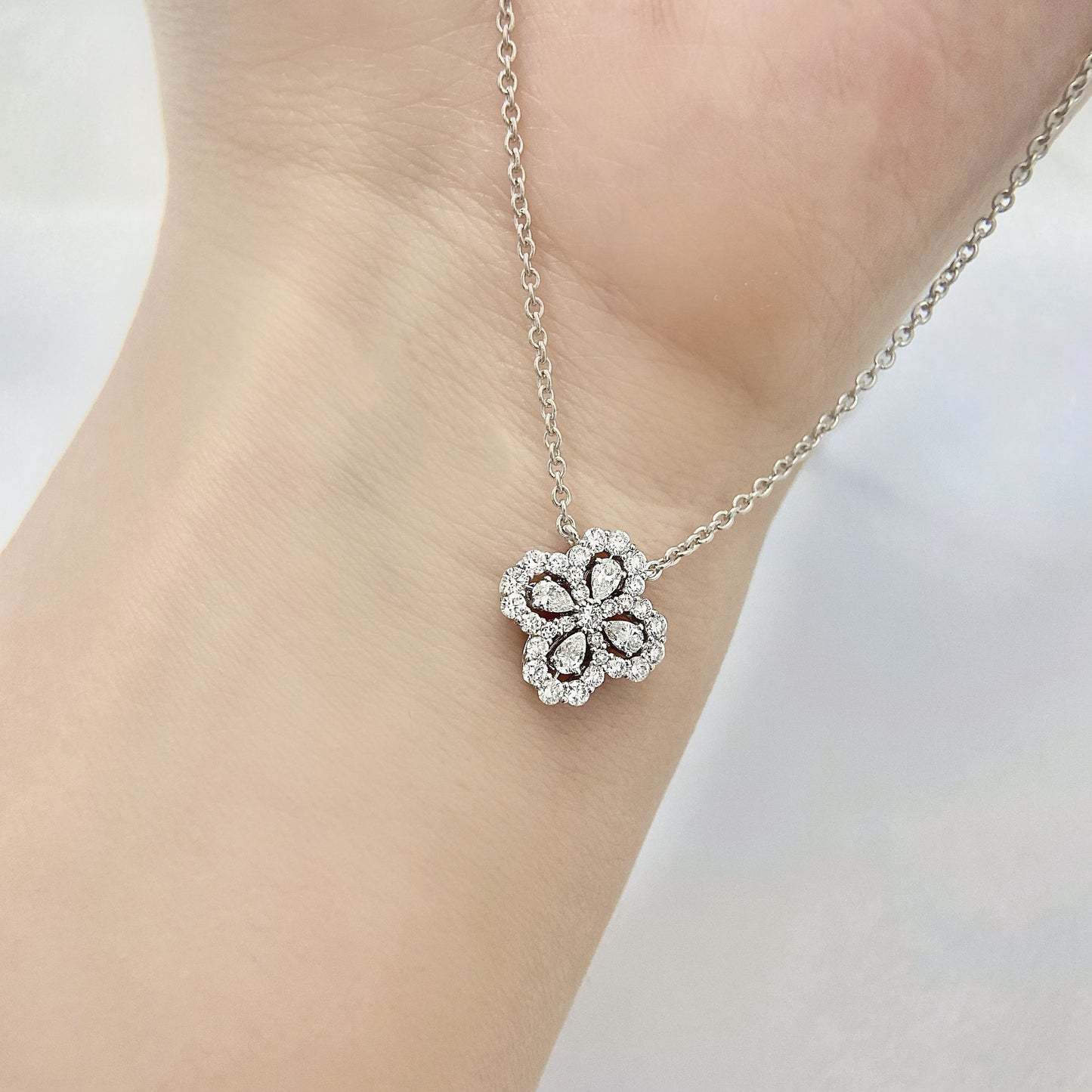 Leaf Clover Necklace with 0.50 TCW Pear & Round Cut Moissanite