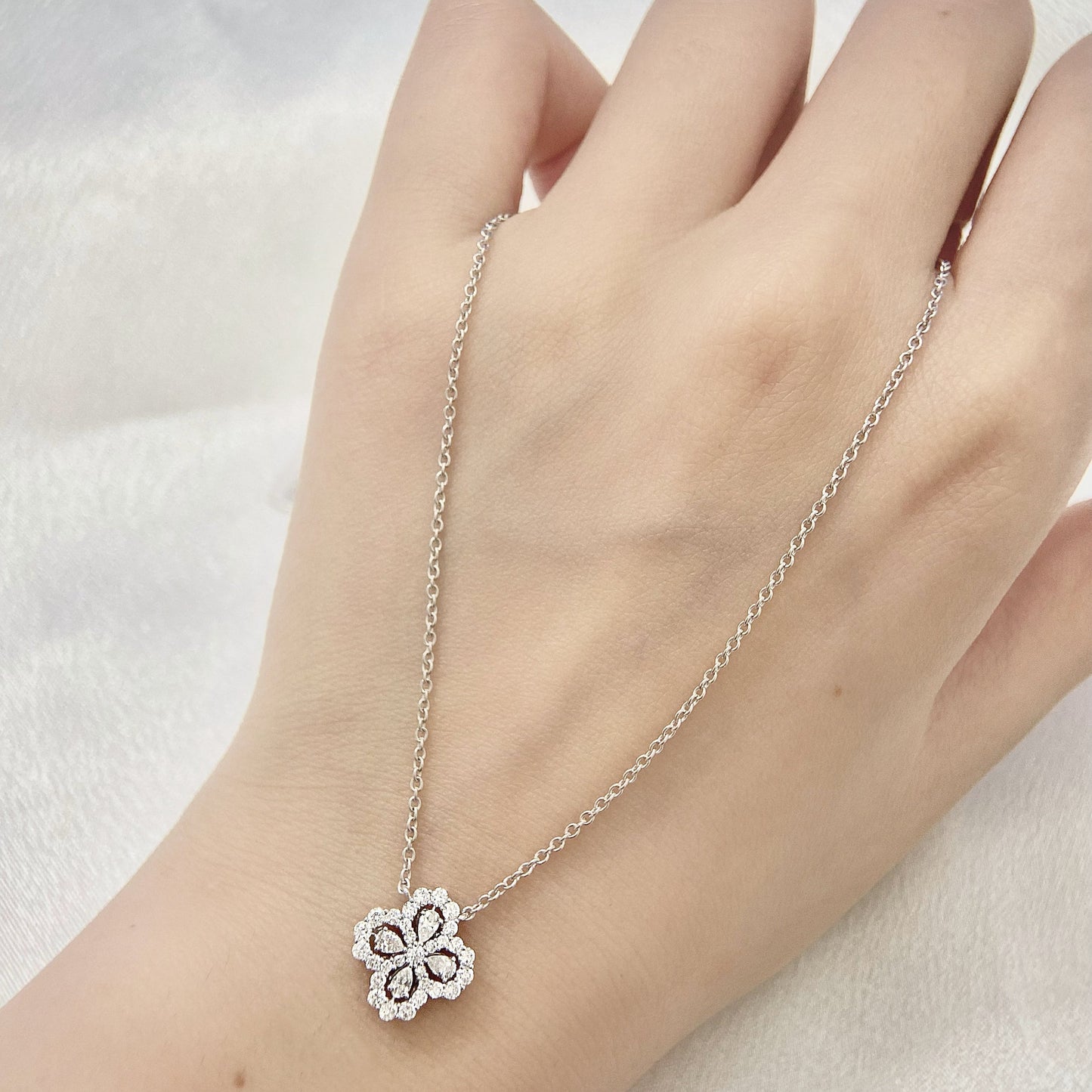 Leaf Clover Necklace with 0.50 TCW Pear & Round Cut Moissanite