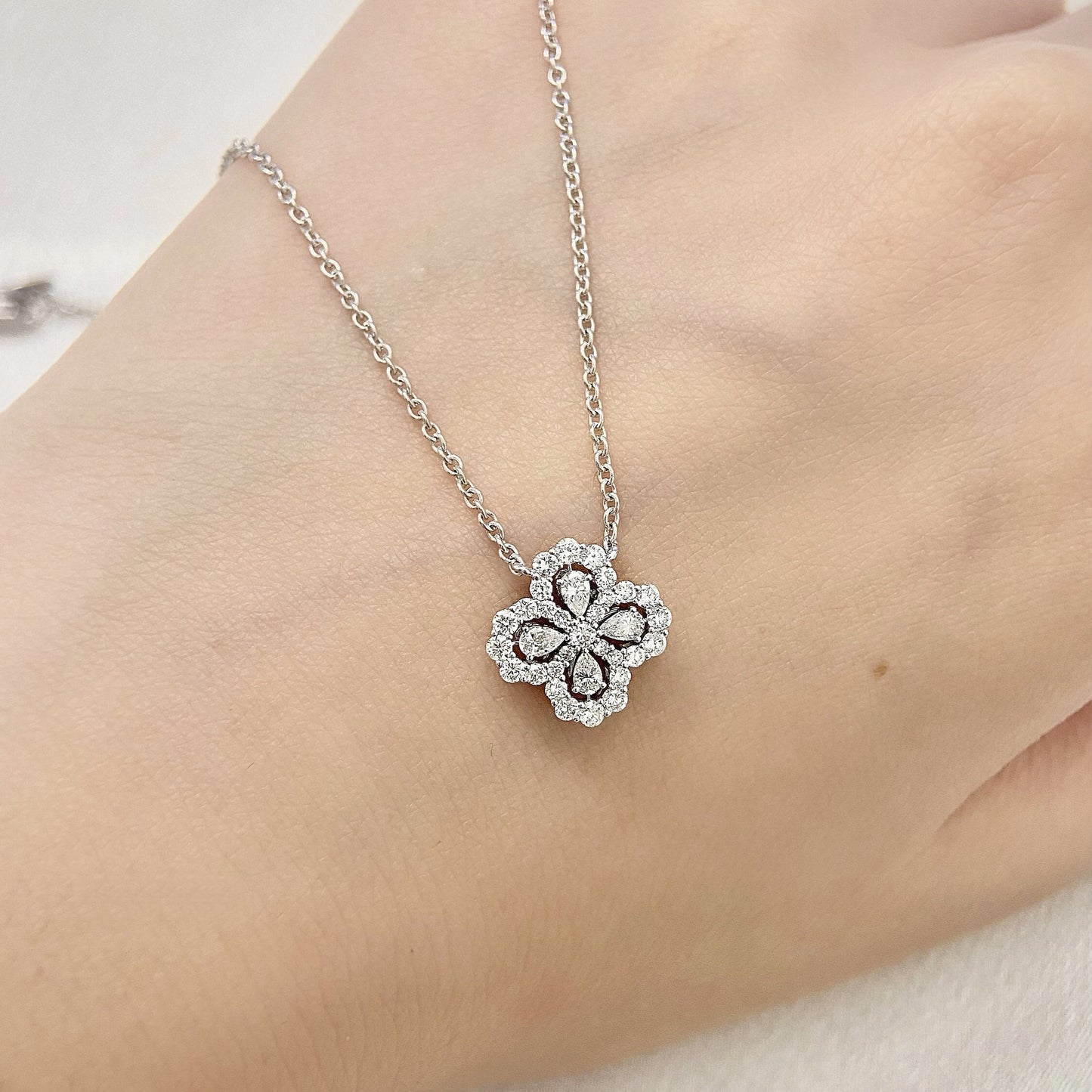 Leaf Clover Necklace with 0.50 TCW Pear & Round Cut Moissanite