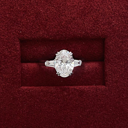 Oval cut CVD diamond three stone style engagement ring