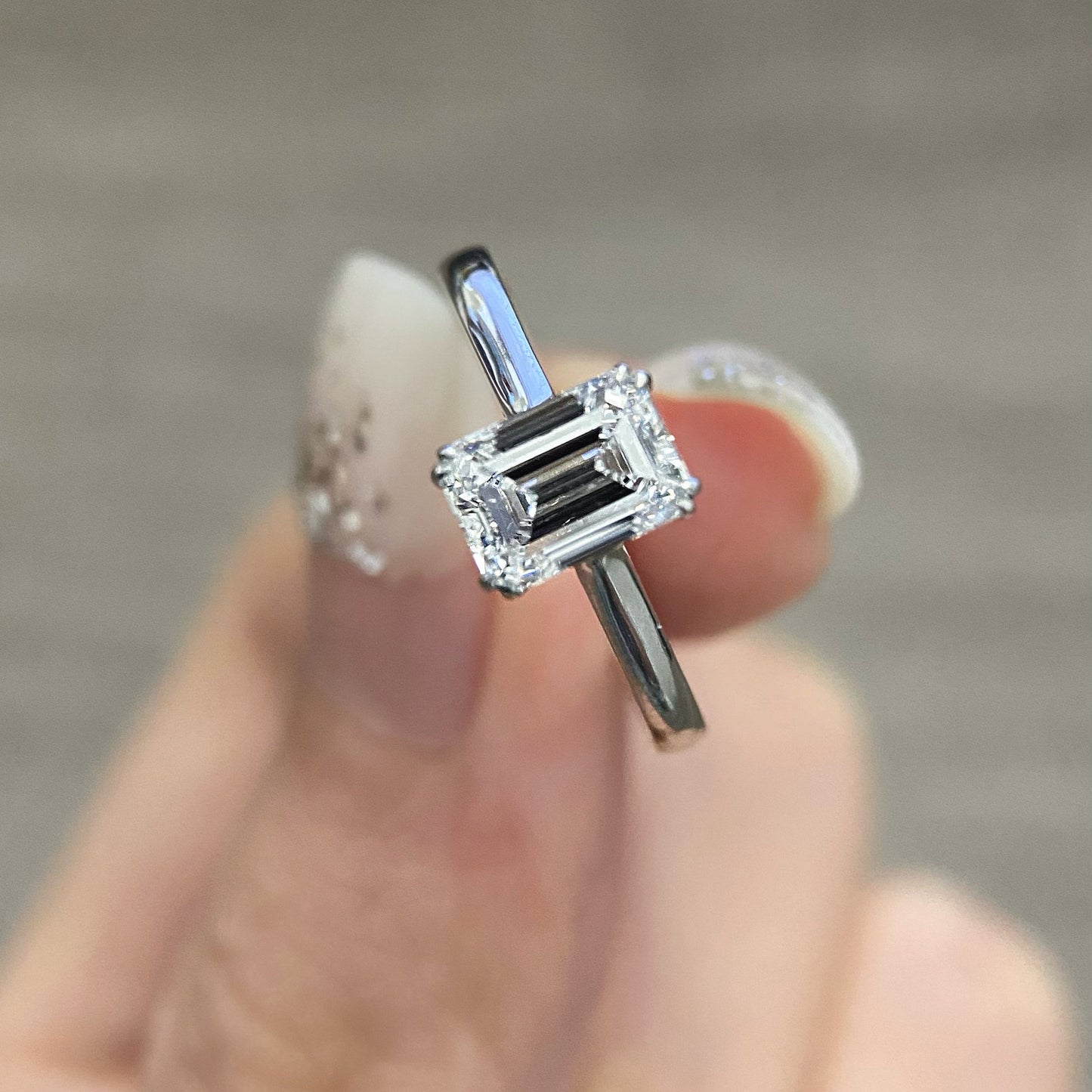Emerald cut CVD diamond solitaire style engagement ring