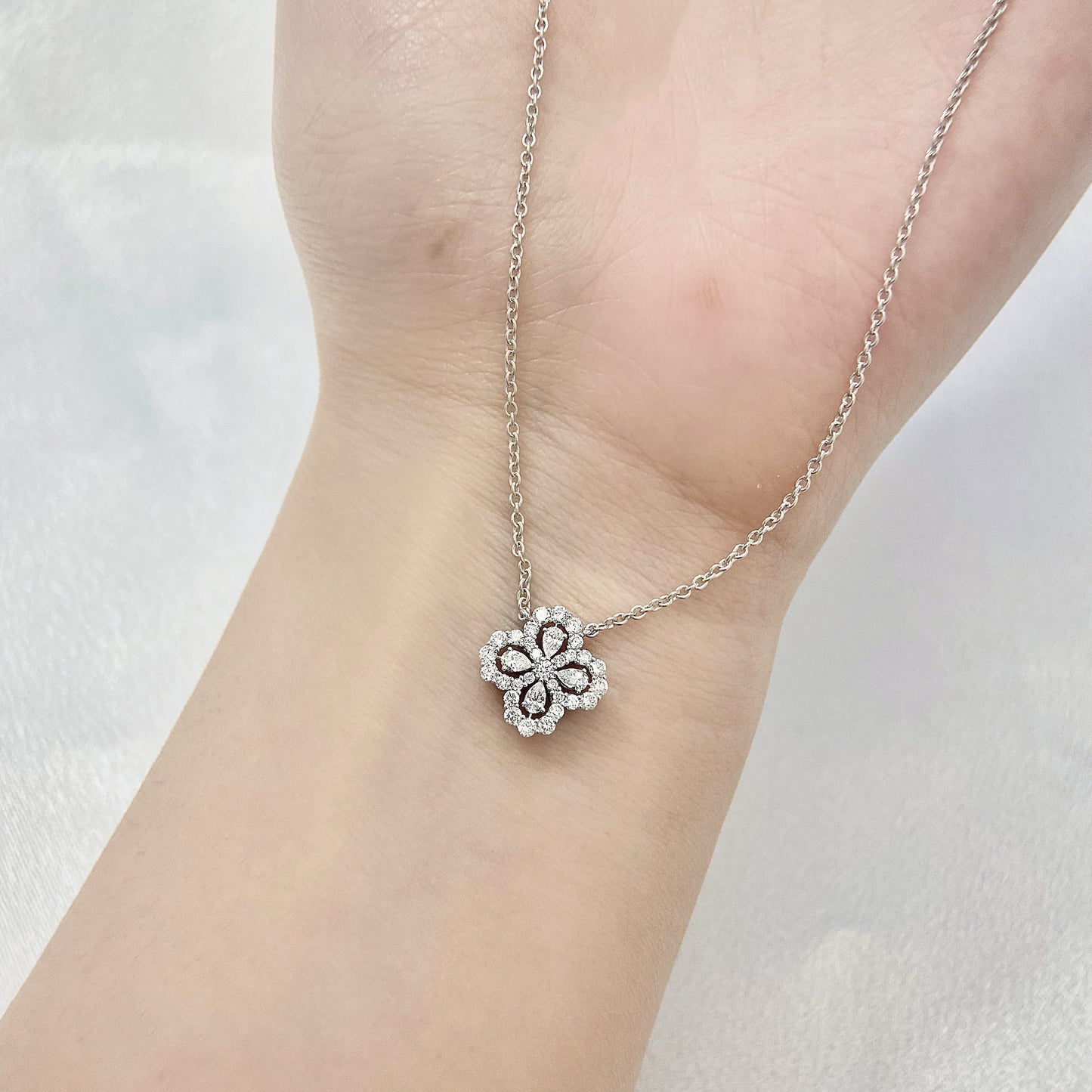 Leaf Clover Necklace with 0.50 TCW Pear & Round Cut Moissanite