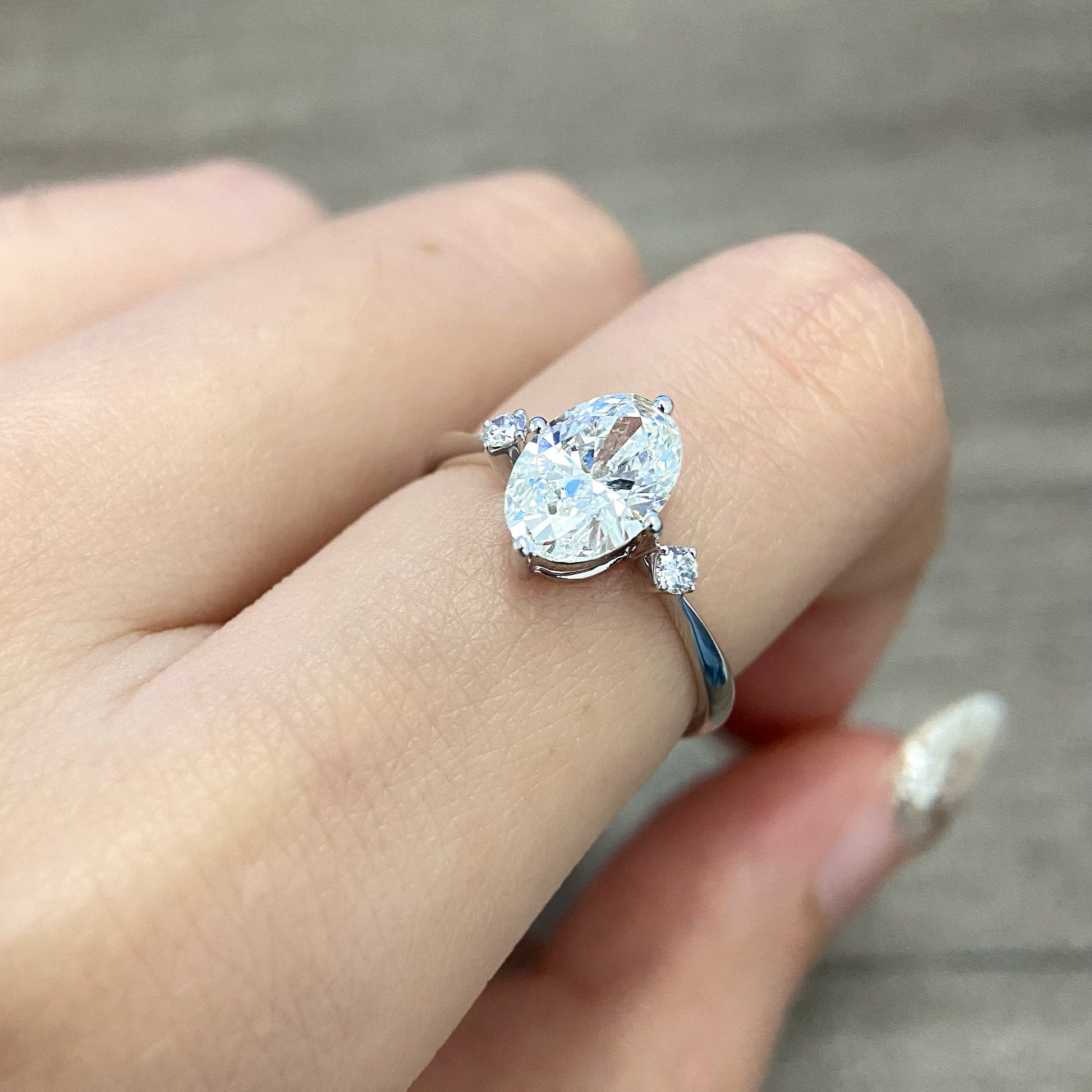 Oval cut CVD diamond three stone style engagement ring