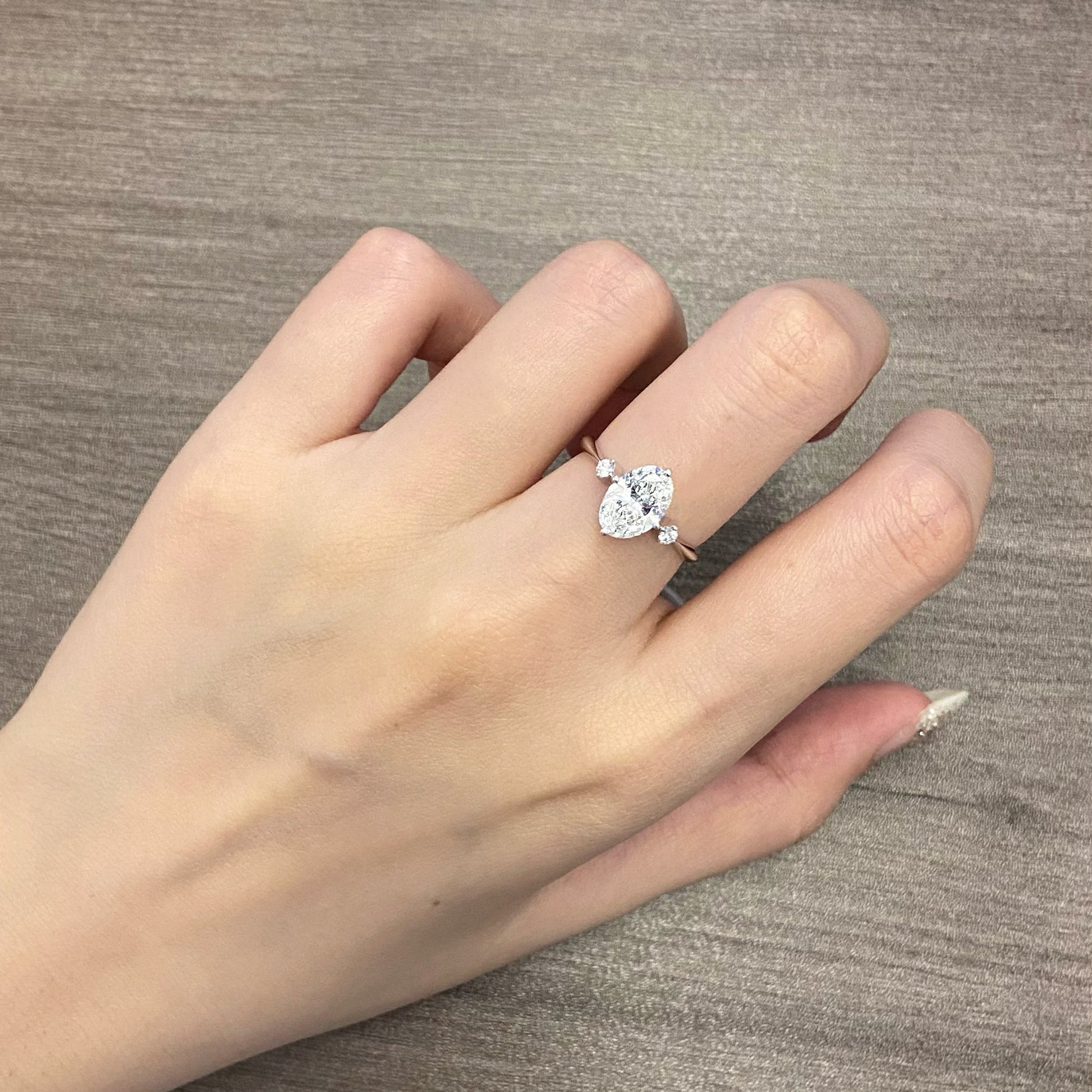 Oval cut CVD diamond three stone style engagement ring