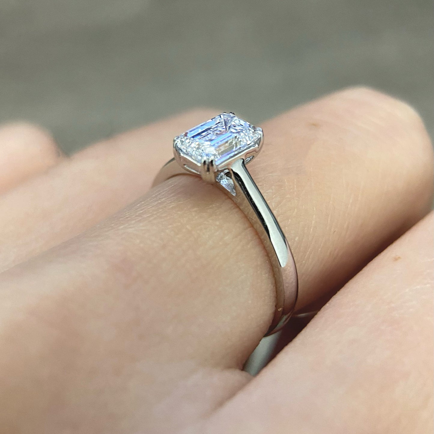 Emerald cut CVD diamond solitaire style engagement ring