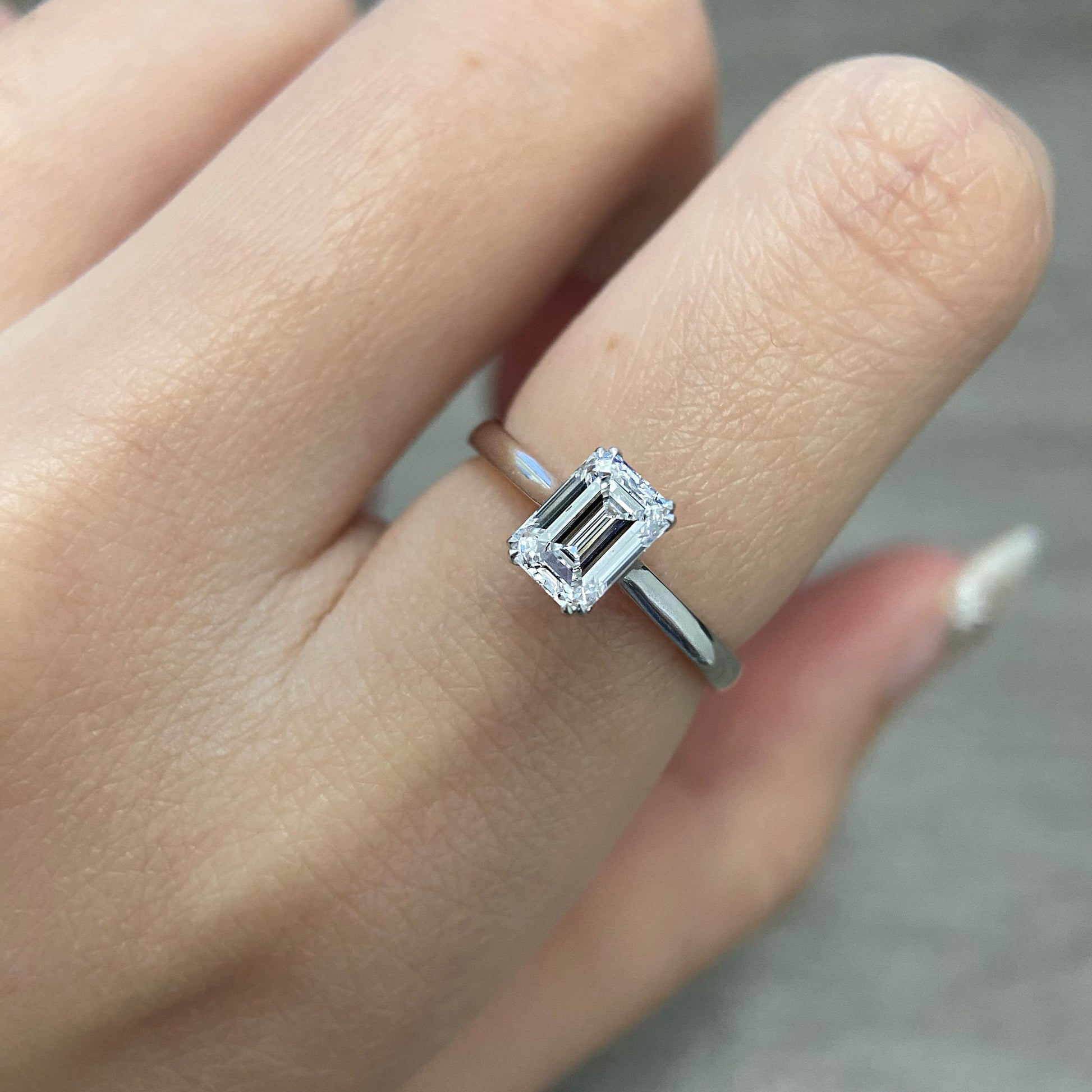 Emerald cut CVD diamond solitaire style engagement ring