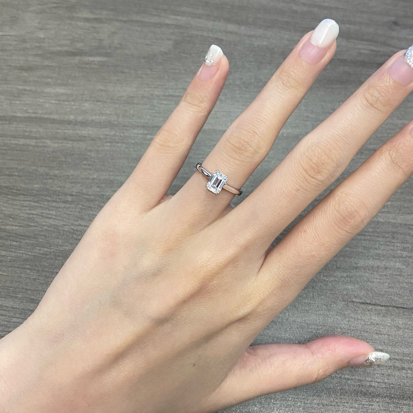Emerald cut CVD diamond solitaire style engagement ring