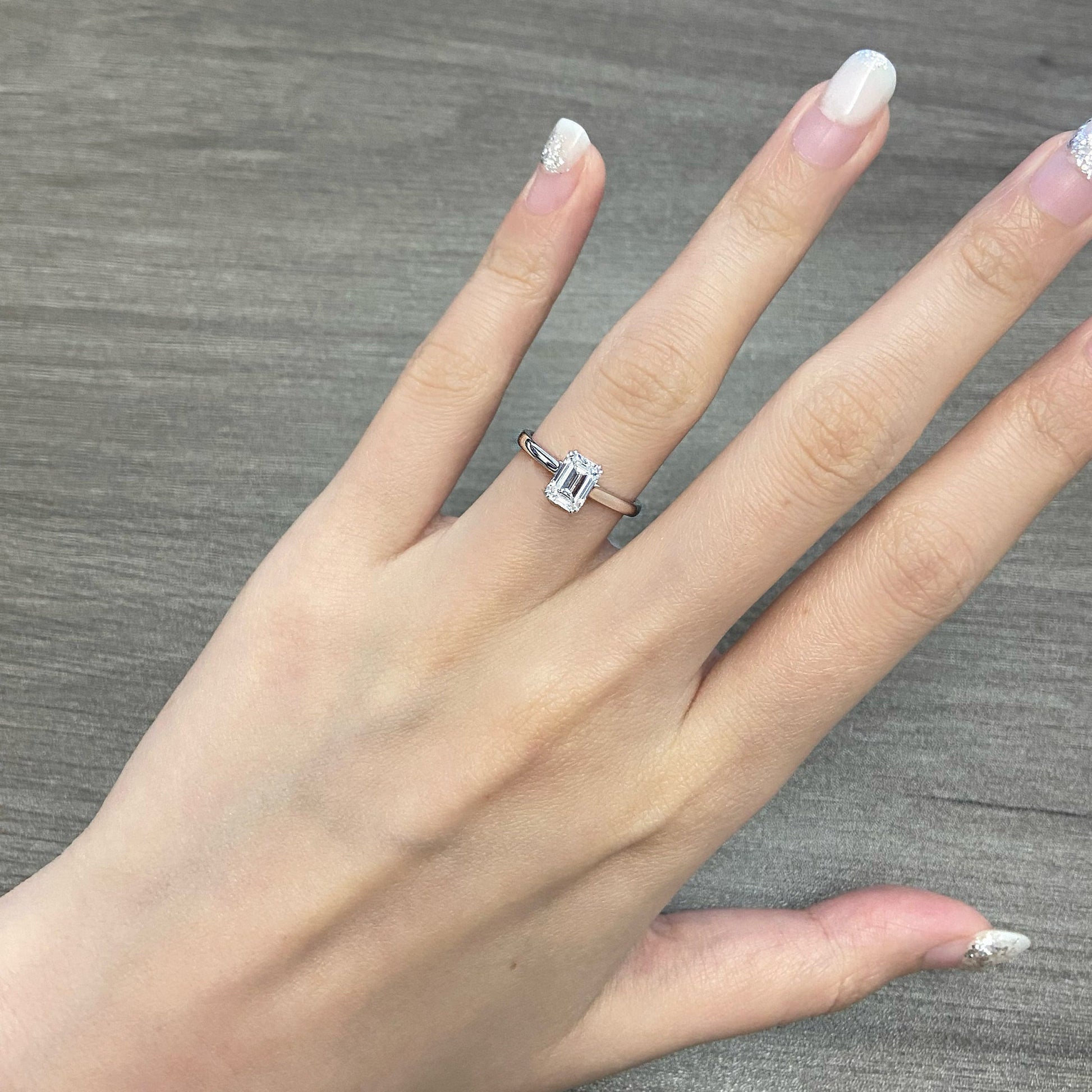 Emerald cut CVD diamond solitaire style engagement ring