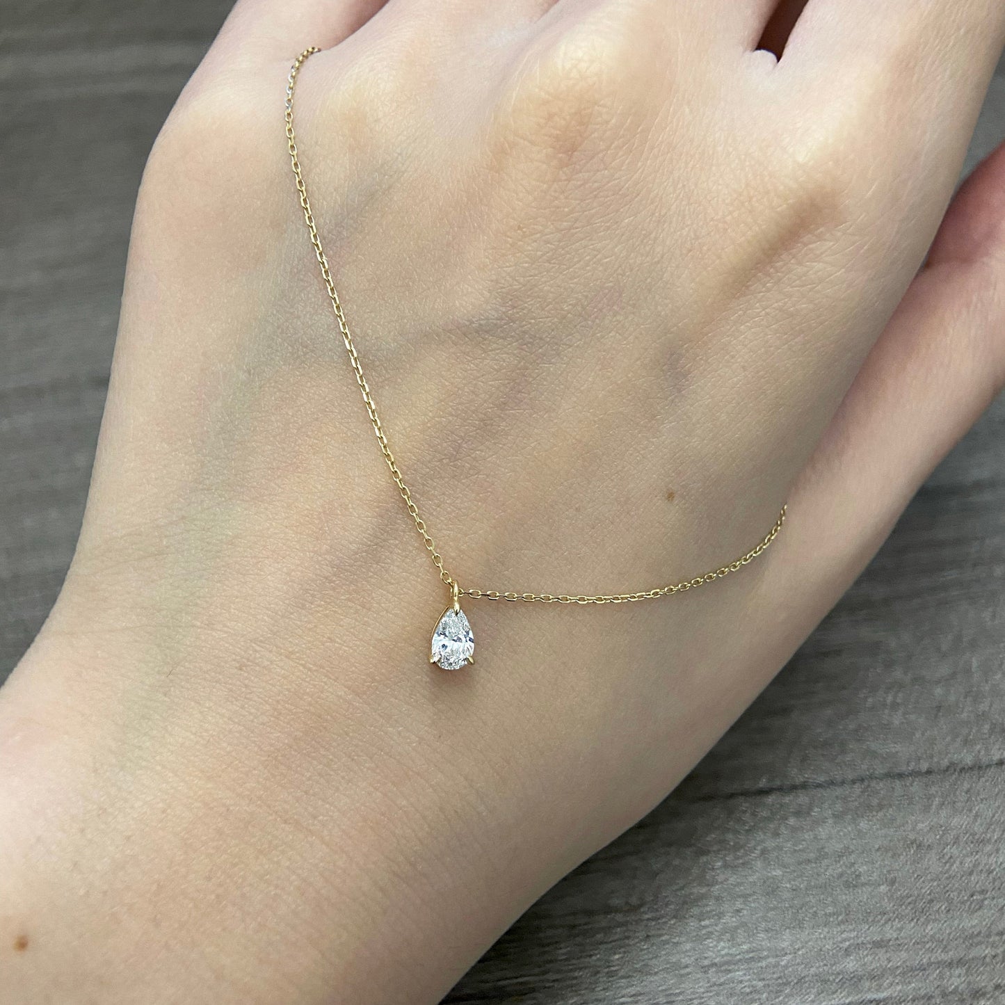 Solitaire Necklace with 0.30 TCW Pear Cut Moissanite